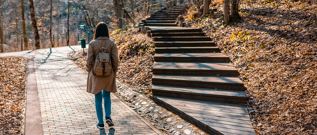 Walking alone on a path, contemplating life choices and direction